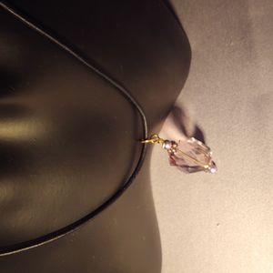 Necklace with Swarovski Amethyst Crystal on Black Leather Cord.